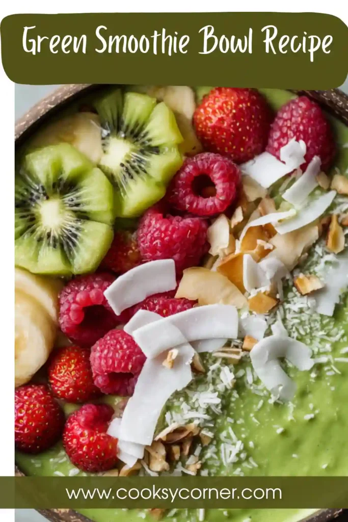 Bright green smoothie bowl with tropical toppings including diced mango and strawberries, perfect for breakfast.