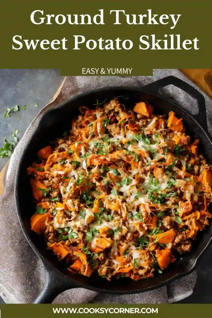 Close-up of a healthy ground turkey skillet with sweet potatoes, peppers, and melted cheese in a rustic pan.