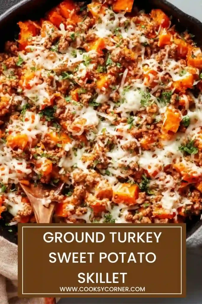 Healthy Ground Turkey Sweet Potato Skillet meal in a rustic pan with colorful vegetables and herbs.
