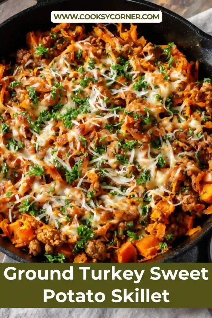 A cast iron Ground Turkey Sweet Potato Skillet topped with melted mozzarella and fresh parsley, showing golden sweet potatoes and browned turkey.