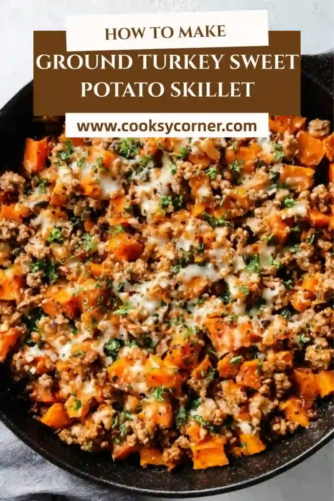 Ground Turkey Sweet Potato Skillet served in a cast iron pan with melted cheese and fresh parsley on top. The dish looks warm, hearty, and freshly cooked.