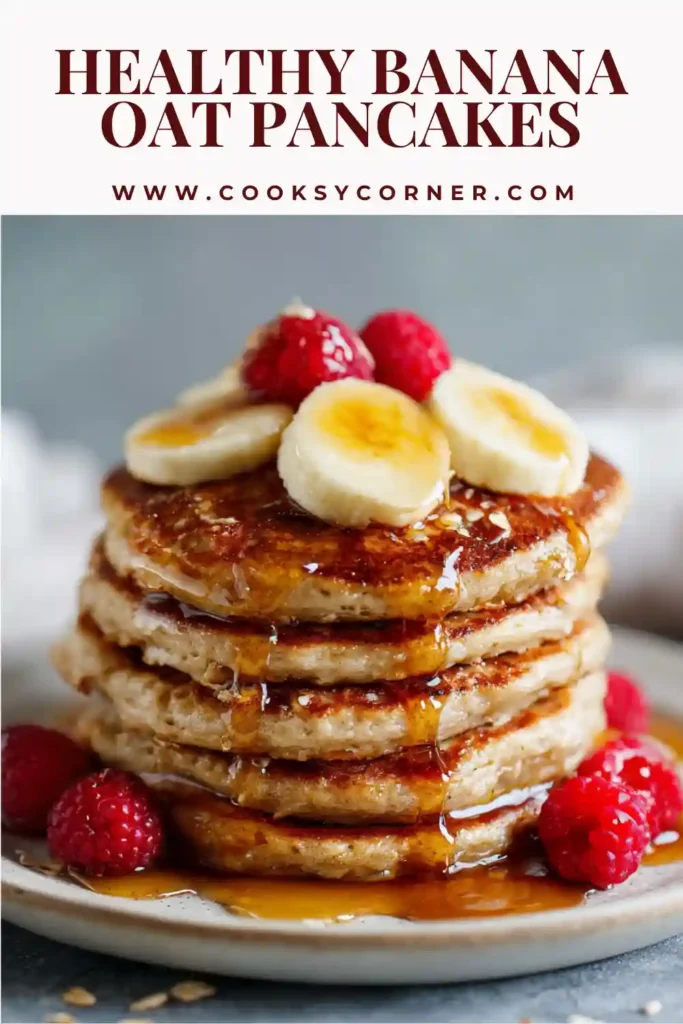 Flourless banana oat pancakes served with fresh fruit and syrup for a healthy breakfast option.