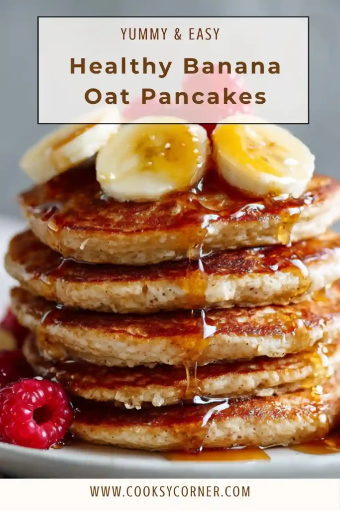 Close-up of fluffy banana oat pancakes with sliced bananas and berries, showing a soft and golden texture.