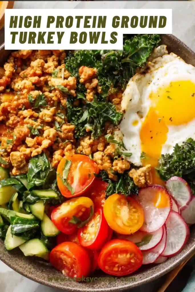 A bowl of high protein ground turkey with roasted sweet potatoes, kale, and peanut sauce. The dish looks colorful and nutritious, ideal for meal prep.