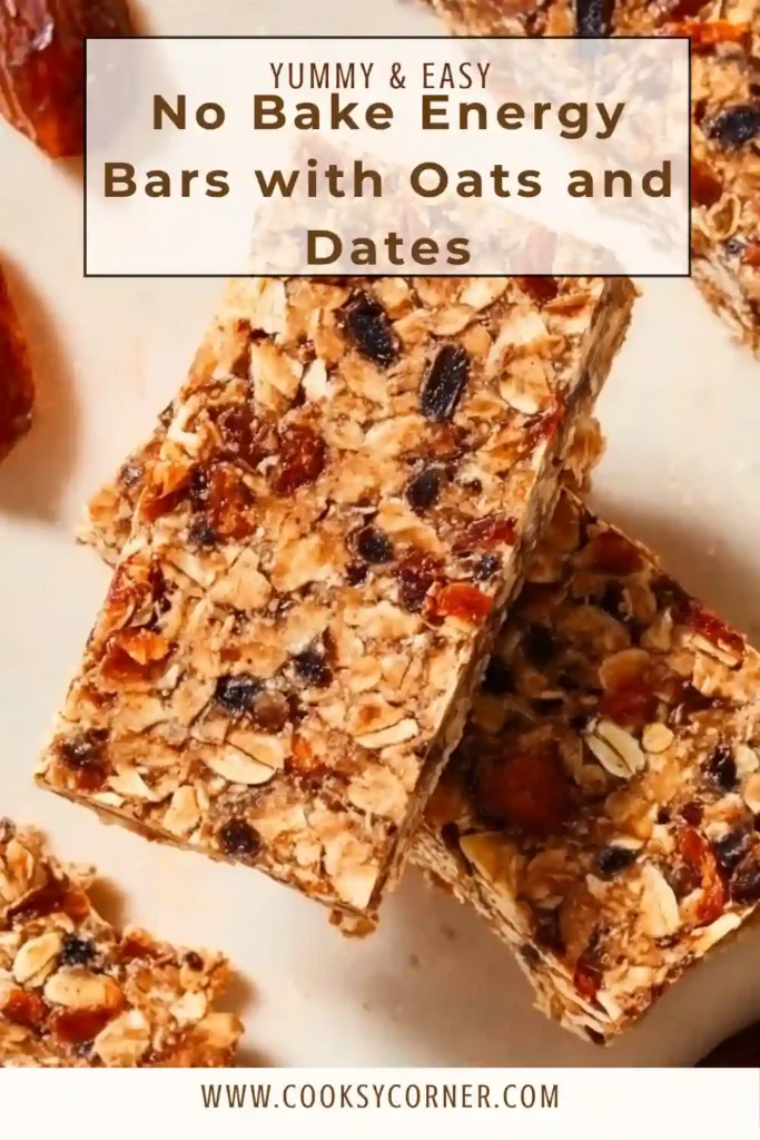 No-bake energy bars made with oats and dates arranged on a wooden board. These bars have a chewy texture with visible nuts and chocolate chips.