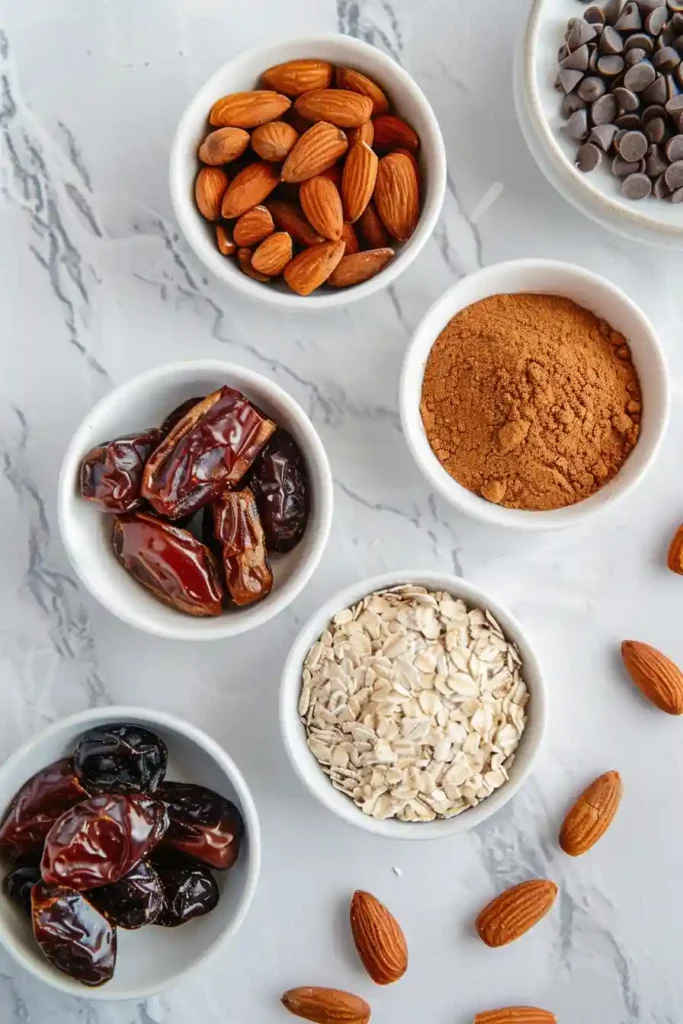 Sliced no-bake energy bars with oats and dates in a parchment-lined tray. A wholesome snack option for meal prep.