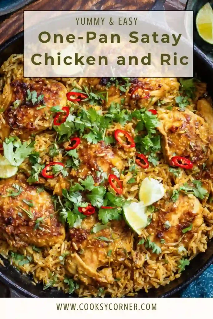 One-pan satay chicken and rice served with peanuts, herbs, and lime wedges in a large skillet. The rice looks fluffy and coated in creamy peanut sauce.
