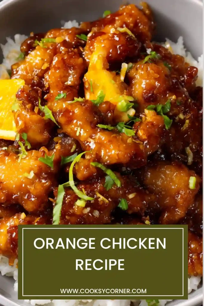 Crispy orange chicken coated in glossy sweet citrus sauce served with rice and garnished with sesame seeds and green onions.