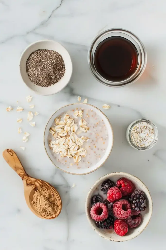 A jar of overnight oats with frozen fruit topped with mixed berries, showing creamy texture and vibrant colors. Perfect healthy breakfast idea.