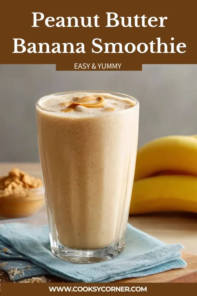 Peanut butter banana smoothie in a glass with creamy texture and banana slices on top.