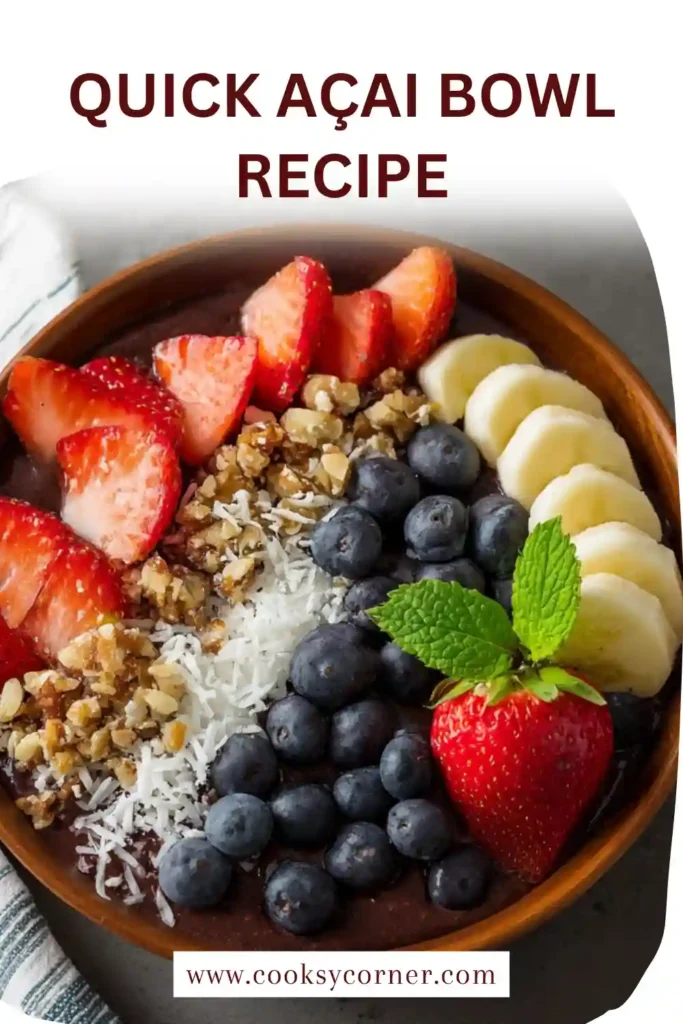 Thick açai smoothie bowl decorated with colorful fruits including kiwi, banana, and berries for a nutritious meal.