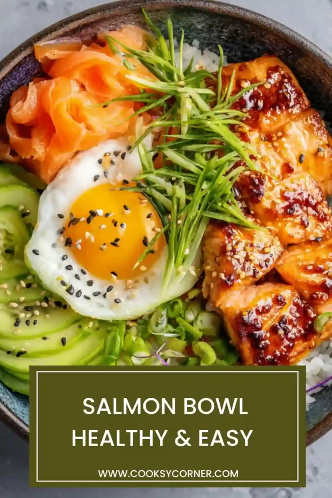 Salmon bowl with rice, avocado, cucumber, carrot, and edamame arranged in a colorful bowl.