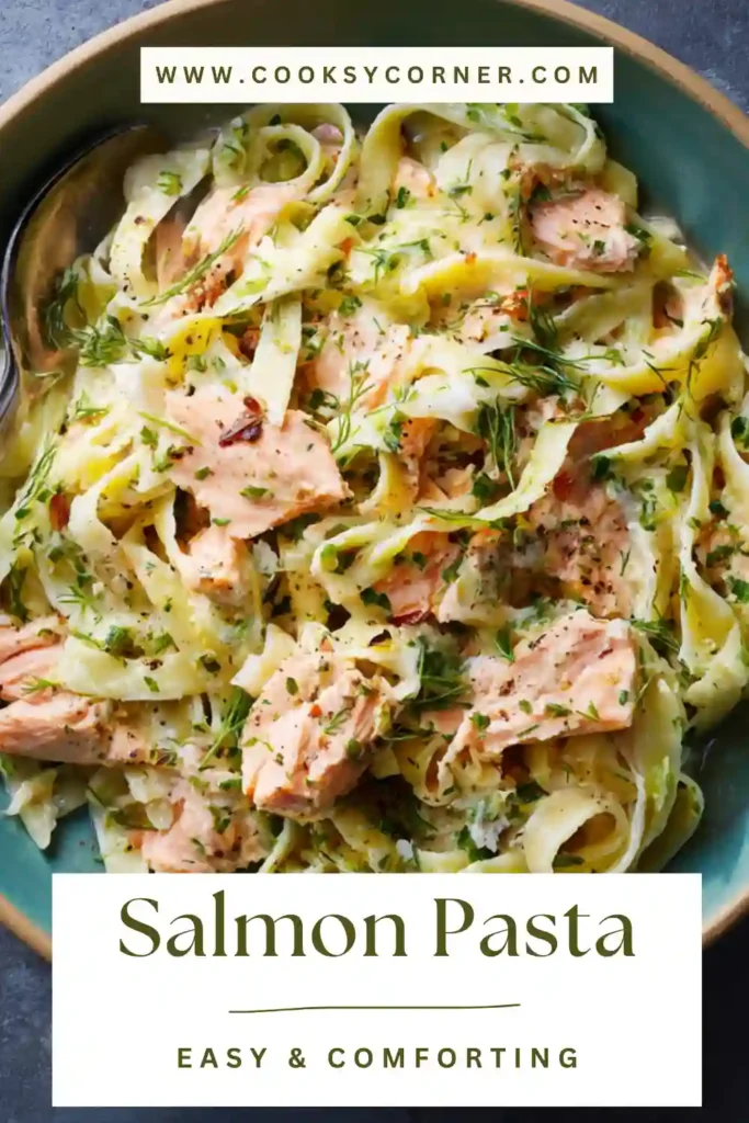 Creamy salmon pasta with flakes of salmon and herbs.