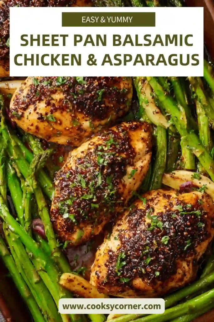 Close-up of balsamic chicken and asparagus on a baking tray with caramelized edges and herbs.