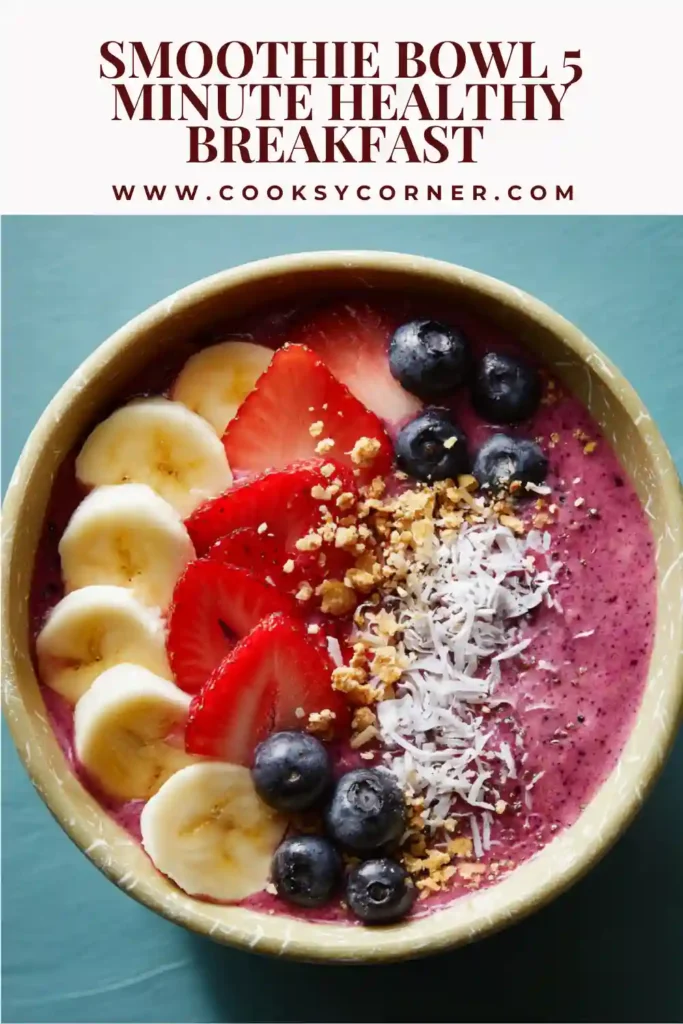 Healthy smoothie bowl with frozen berries and banana blended into a creamy texture and topped with seeds and granola.