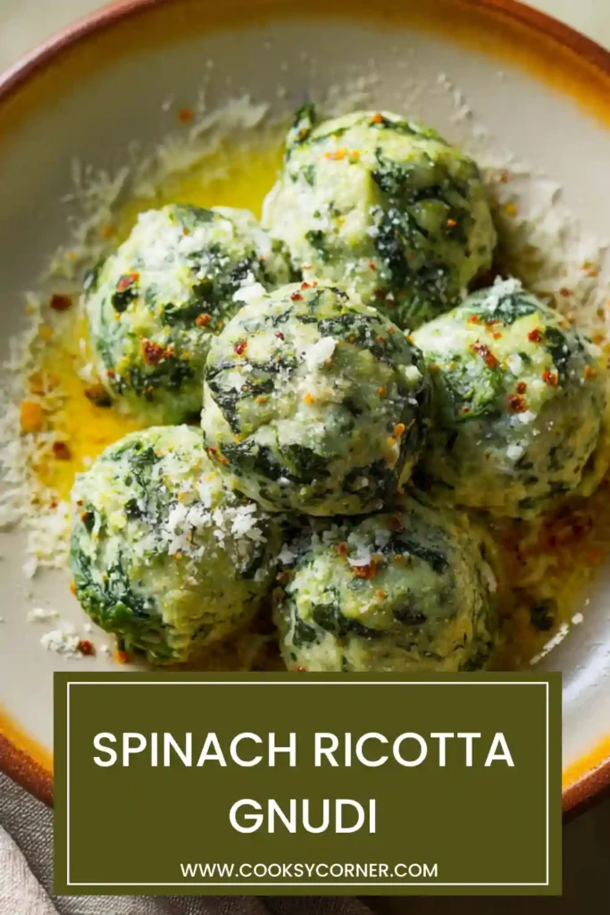 Homemade spinach ricotta dumplings plated with parmesan and herbs.