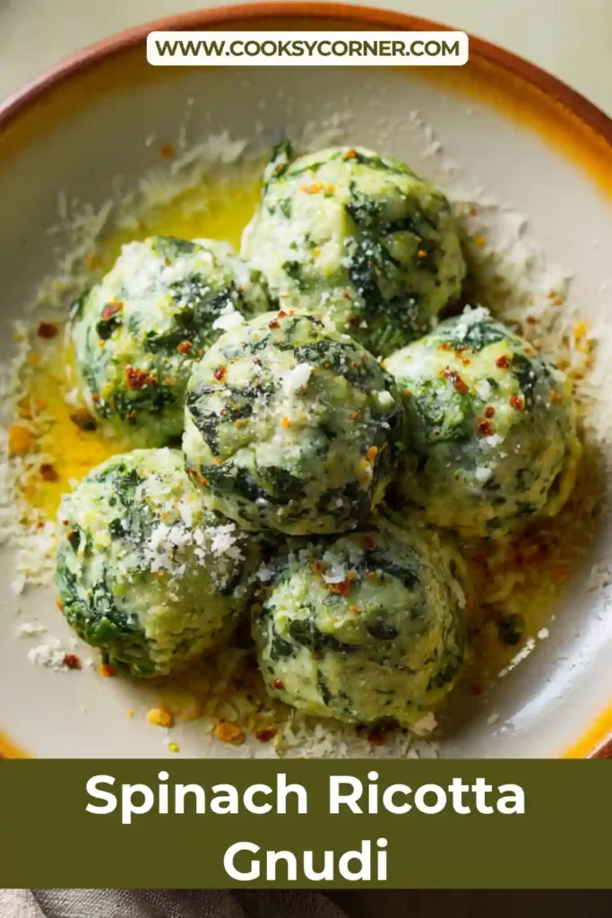 Close-up of Italian gnudi made with ricotta and spinach coated in buttery chili sauce.
