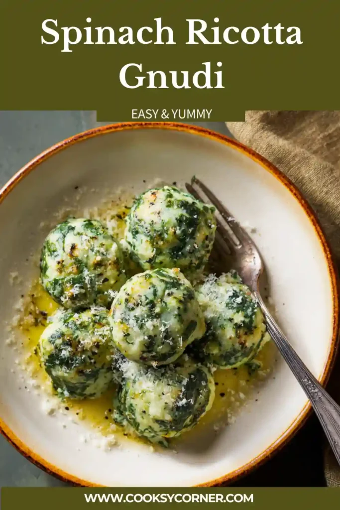 Spinach ricotta gnudi served in a butter sauce with herbs, showing soft dumplings and creamy texture.