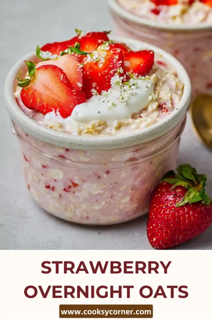 Strawberry overnight oats in a glass jar with fresh fruit topping, ideal for a quick no-cook breakfast option.