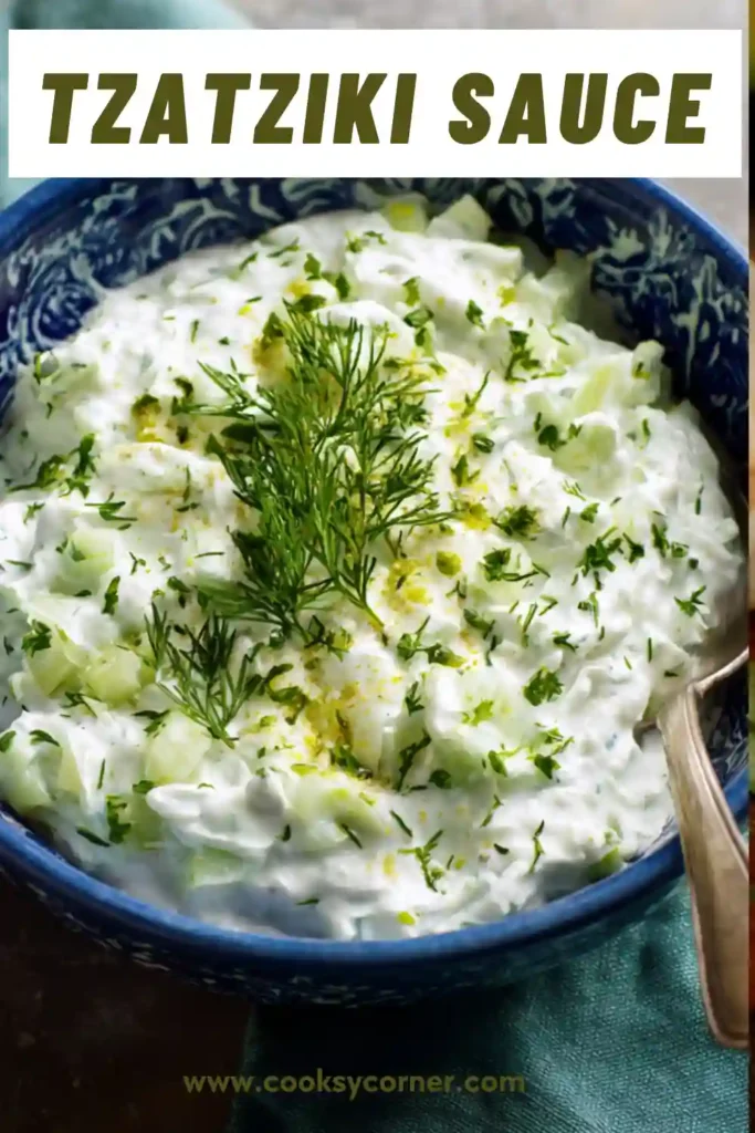 Homemade tzatziki sauce garnished with fresh dill and olive oil.