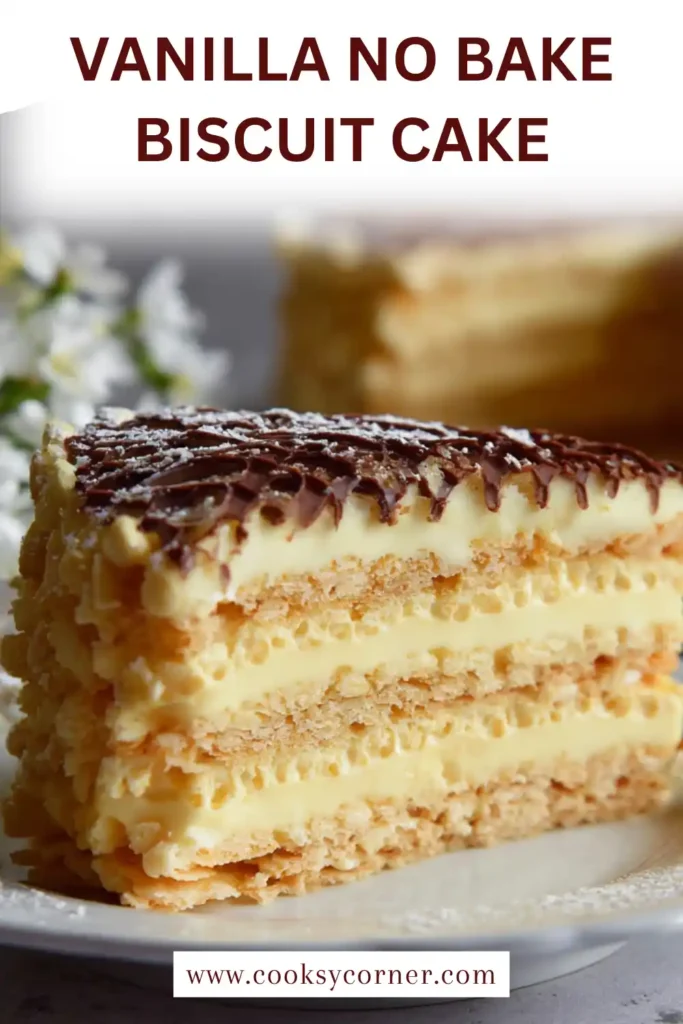 A square pan of no bake biscuit cake with layers of custard and biscuits, finished with melted chocolate. The dessert appears creamy and indulgent.