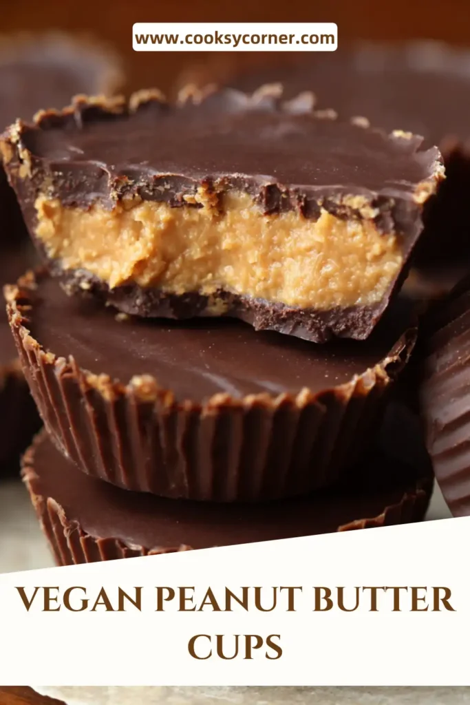 Close-up of vegan chocolate peanut butter cups with glossy coating and soft center.