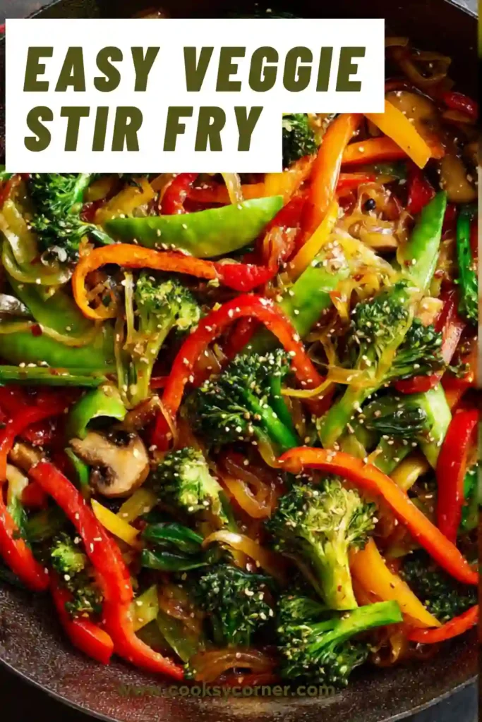 A bowl of easy veggie stir fry with broccoli, bell peppers, and carrots coated in a glossy stir fry sauce. The vegetables look vibrant and fresh.
