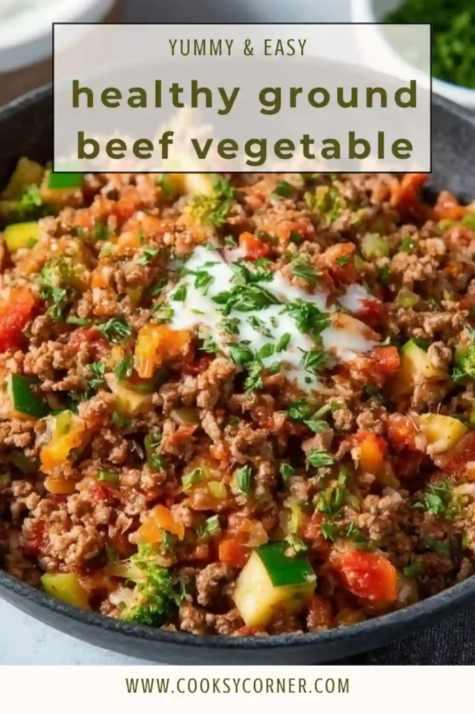 A healthy ground beef vegetable skillet with colorful bell peppers and zucchini cooked in a cast iron pan. The dish looks fresh, vibrant, and ready to serve.