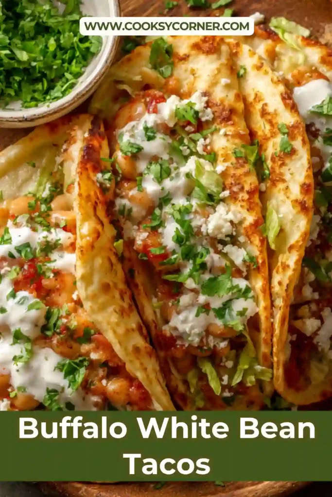 Close-up of Buffalo White Bean Tacos topped with avocado slices and fresh vegetables. These spicy vegetarian tacos are easy, healthy, and full of flavor.
