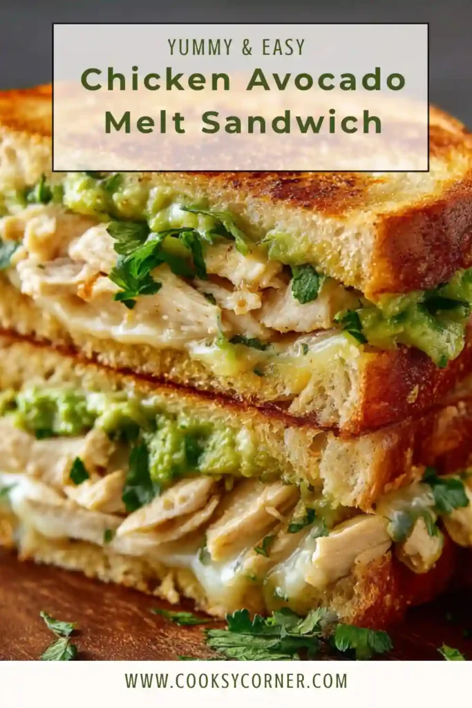 A crispy Chicken Avocado Melt Sandwich filled with juicy seasoned chicken, creamy avocado spread, and melted cheddar cheese on toasted golden bread. The sandwich is sliced in half and garnished with fresh cilantro.