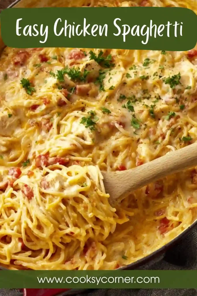 Creamy Chicken Spaghetti casserole baked with melted cheddar and mozzarella cheese in a white baking dish. This easy baked pasta dinner is hearty and comforting.