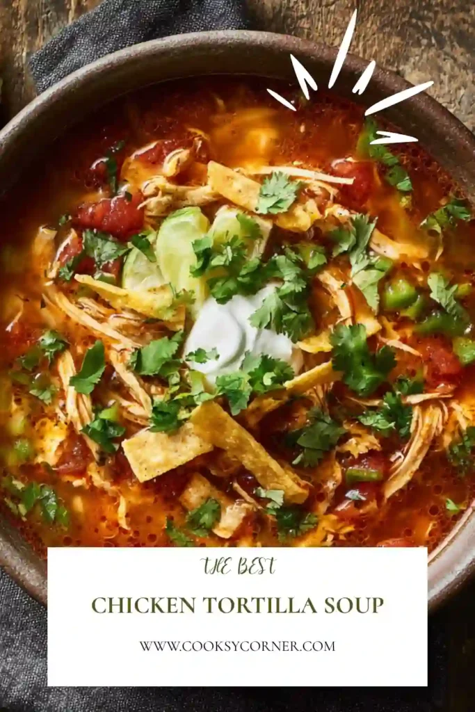 Comforting Tortilla Soup Recipe in a rustic bowl topped with avocado, cilantro, and crispy tortilla strips. This homemade soup is packed with smoky spices and tender shredded chicken.