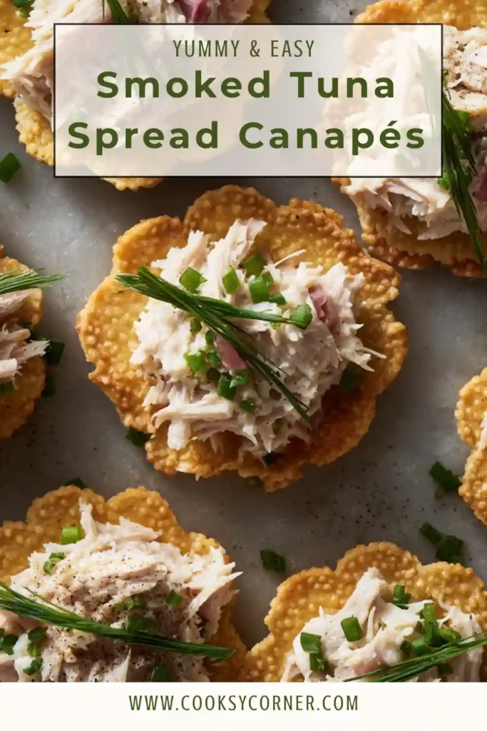 Tuna canapé bites topped with creamy smoked spread and fresh chives on a serving platter.