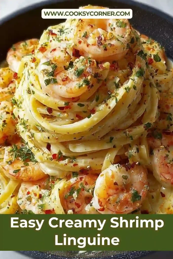 Close-up of creamy shrimp linguine with tender shrimp, silky white sauce, and freshly grated Parmesan cheese. The pasta is garnished with herbs and lemon zest.