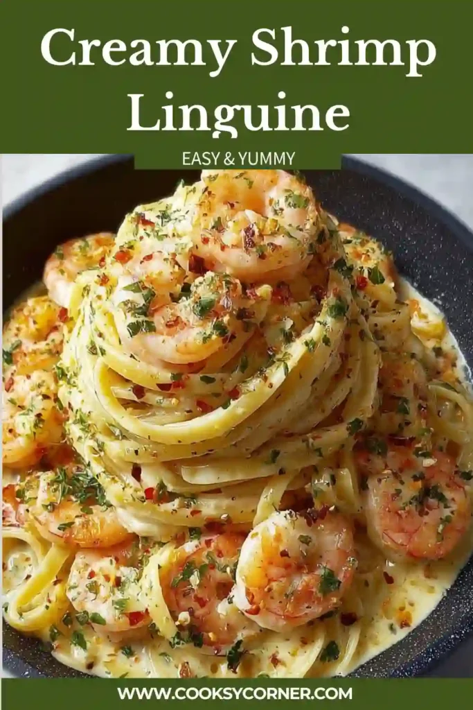 A bowl of creamy shrimp linguine topped with Parmesan cheese, fresh parsley, and lemon zest. The shrimp are perfectly cooked and coated in a rich garlic cream sauce.