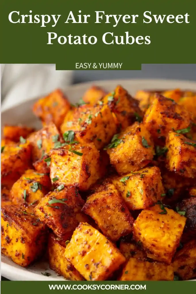 A bowl of Crispy Air Fryer Sweet Potato Cubes seasoned with paprika, garlic powder, and parsley. The sweet potatoes are golden brown and perfectly crispy on the outside.