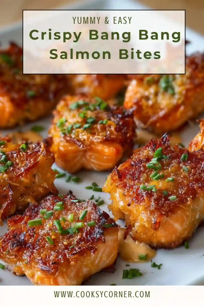 Homemade Crispy Bang Bang Salmon Bites served with sweet chili sauce and fresh herbs. The baked salmon pieces are crispy outside and juicy inside.
