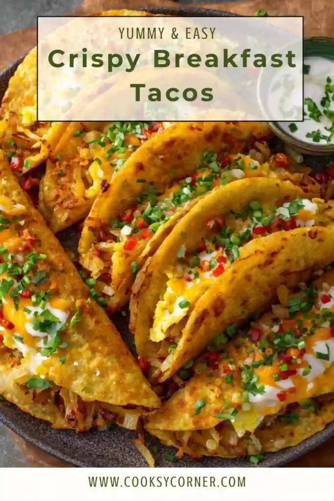 Close-up of crispy breakfast tacos filled with potatoes, eggs, cheddar cheese, onions, and avocado. The tacos are toasted until crunchy and golden brown.