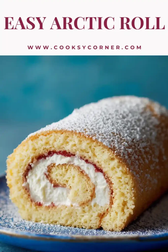 A sliced Arctic Roll recipe showing layers of sponge cake, vanilla ice cream, and strawberry jam filling on a plate.