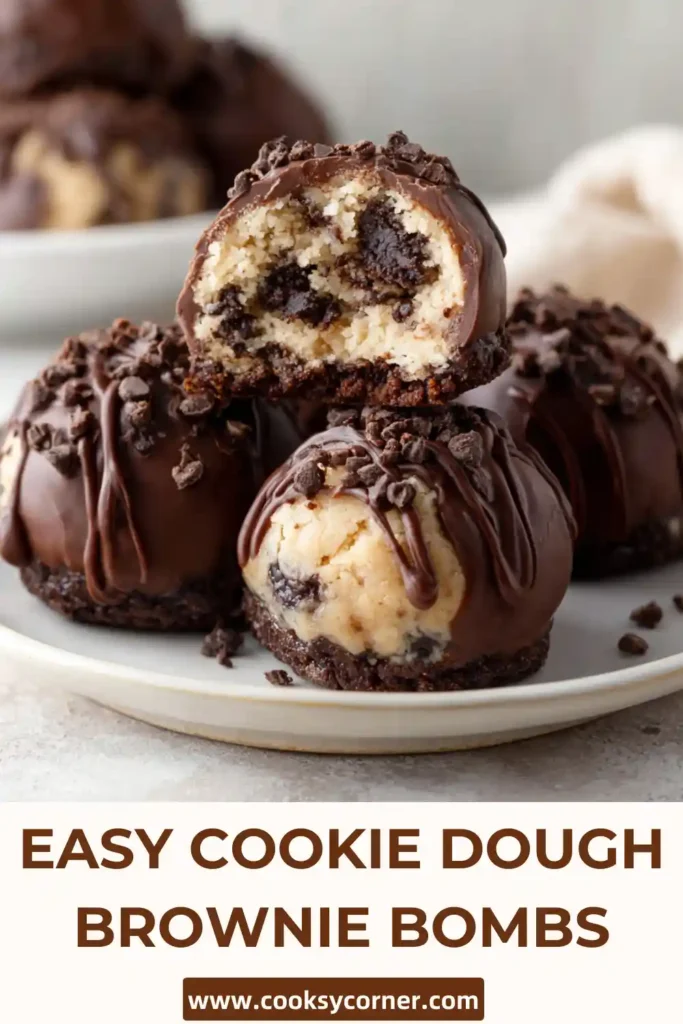 Fudgy Cookie Dough Brownie Bombs arranged on a serving tray with smooth melted chocolate coating. These brownie bites are ideal for holidays and special occasions.