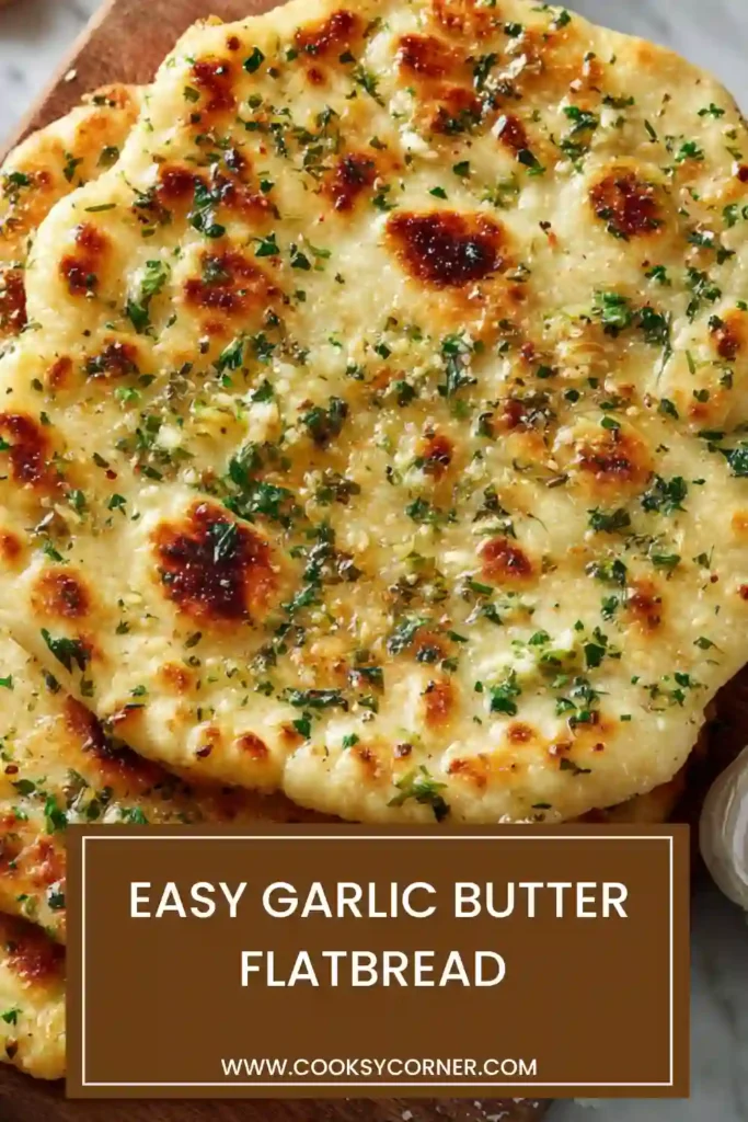Freshly cooked garlic butter flatbread stacked on a plate with melted butter and chopped parsley. This homemade flatbread recipe is soft, golden, and perfect for family dinners.