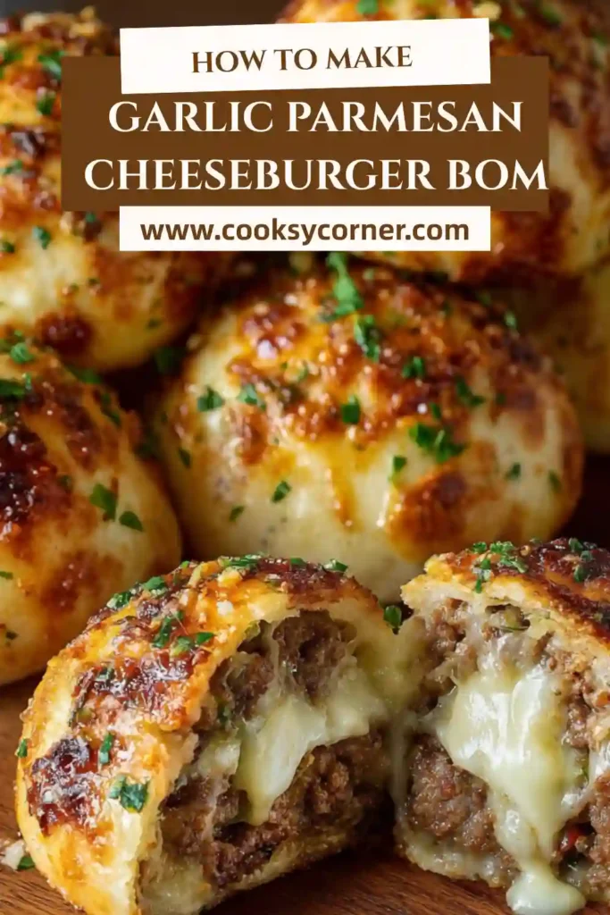 Close-up of Garlic Parmesan Cheeseburger Bombs brushed with melted butter and baked golden brown. These stuffed biscuit bombs are cheesy, savory, and family-friendly.