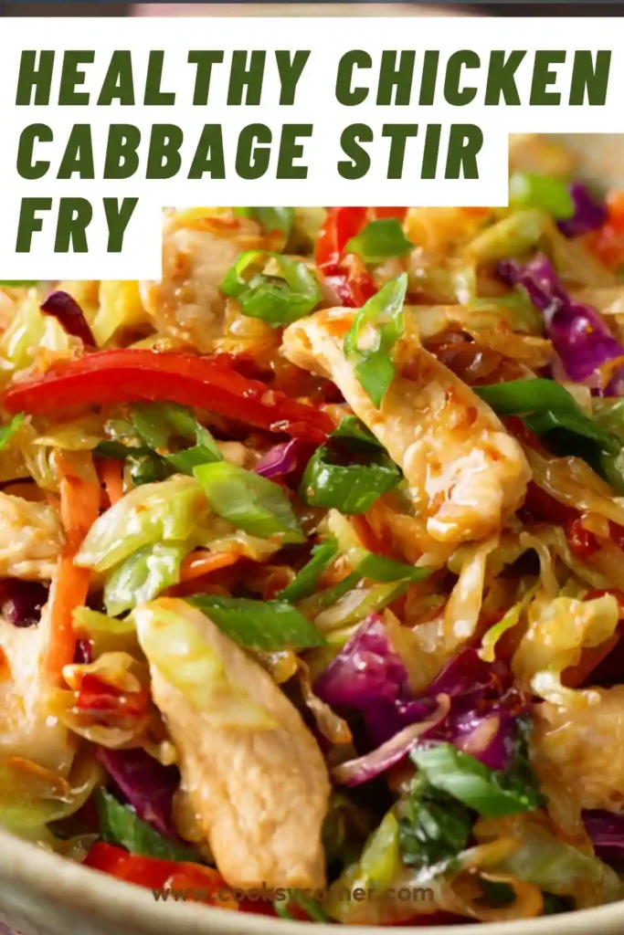 A bowl of chicken cabbage stir fry with tender chicken pieces, shredded cabbage, carrots, and sesame seeds.