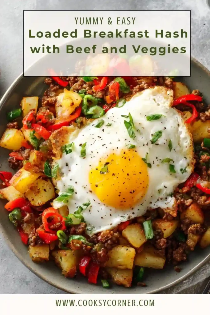 Homemade Loaded Breakfast Hash with golden potatoes, colorful vegetables, seasoned beef, and creamy avocado garnish. Warm and comforting brunch dish.