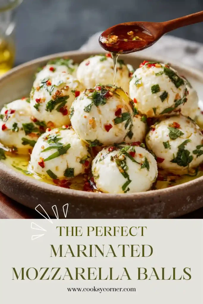 Fresh mozzarella pearls marinated in olive oil with herbs, garlic, and lemon juice. A simple mozzarella appetizer served in a glass jar.