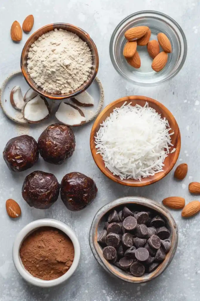 Healthy no bake coconut protein balls served as a high protein snack with dark chocolate chips and cacao. These easy homemade energy bites are chewy, satisfying, and freezer-friendly.
