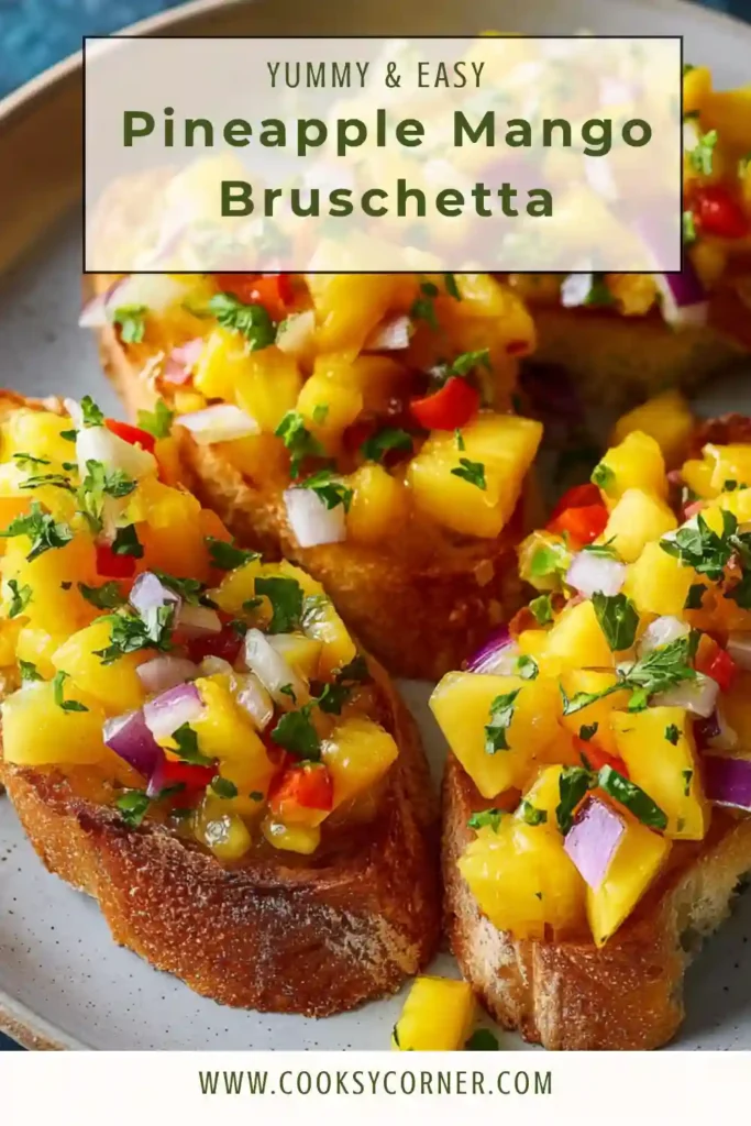 Golden toasted bread topped with pineapple mango salsa made with bell pepper, lime juice, and cilantro. A bright summer bruschetta appetizer served on a white platter.