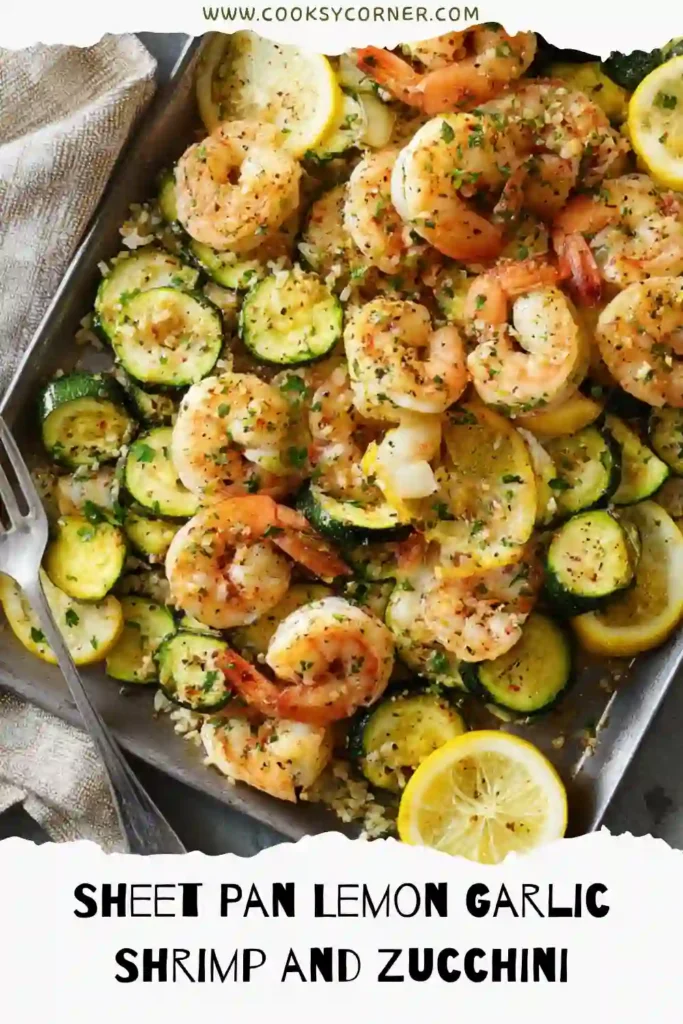 Healthy shrimp and zucchini sheet pan meal topped with parsley and toasted pine nuts.