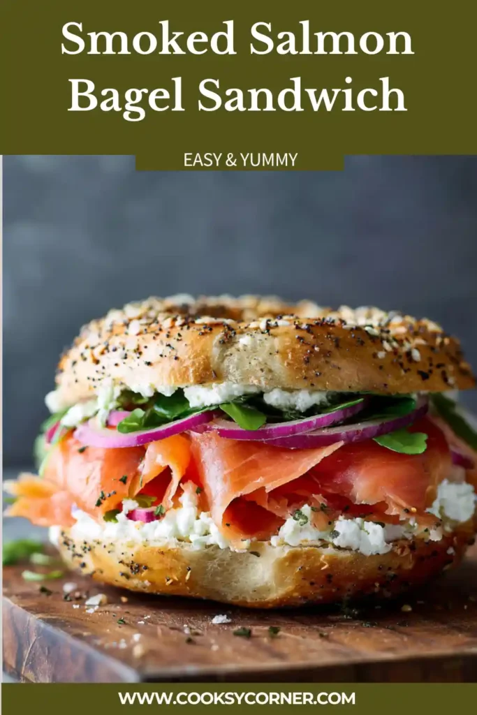 Smoked Salmon Bagel Sandwich layered with cream cheese, smoked salmon, cucumbers, tomatoes, microgreens, and capers.