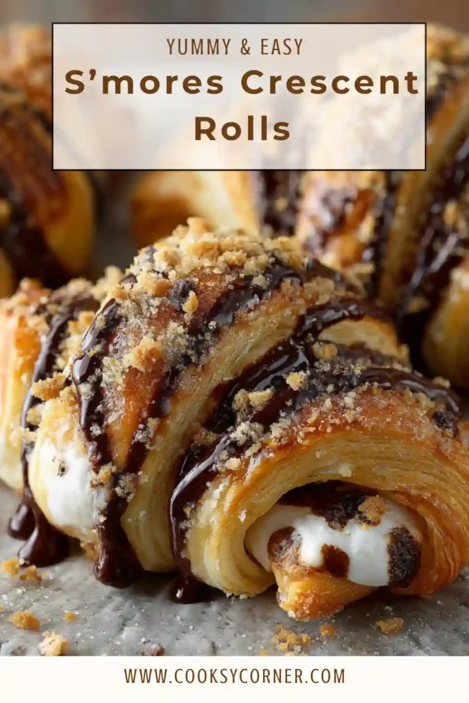 Close-up view of homemade S’mores Crescent Rolls on a serving plate. The flaky pastry reveals melted chocolate and marshmallow centers.